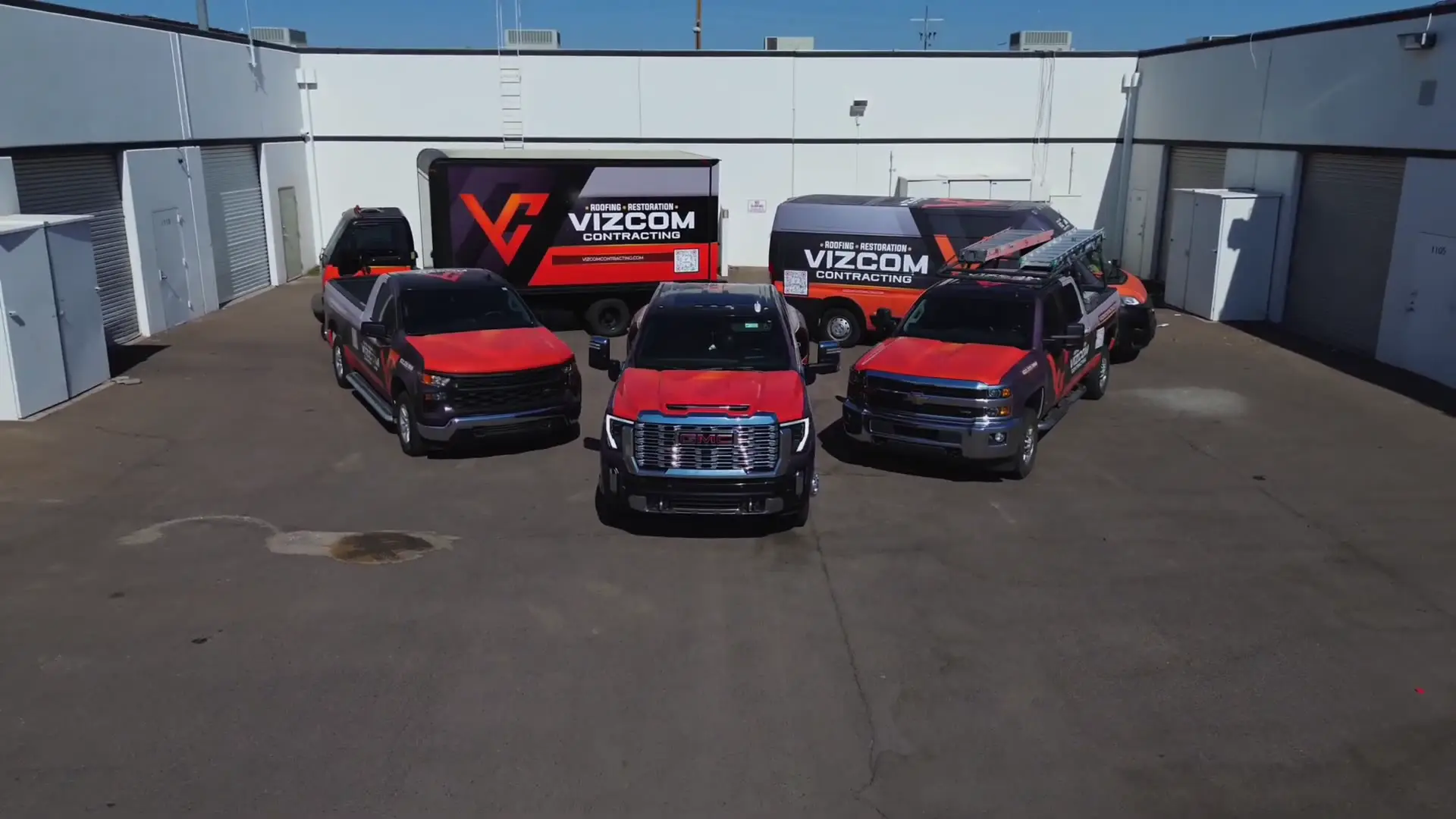 The Vizcom Contracting fleet of wrapped trucks parked at its Phoenix yard
